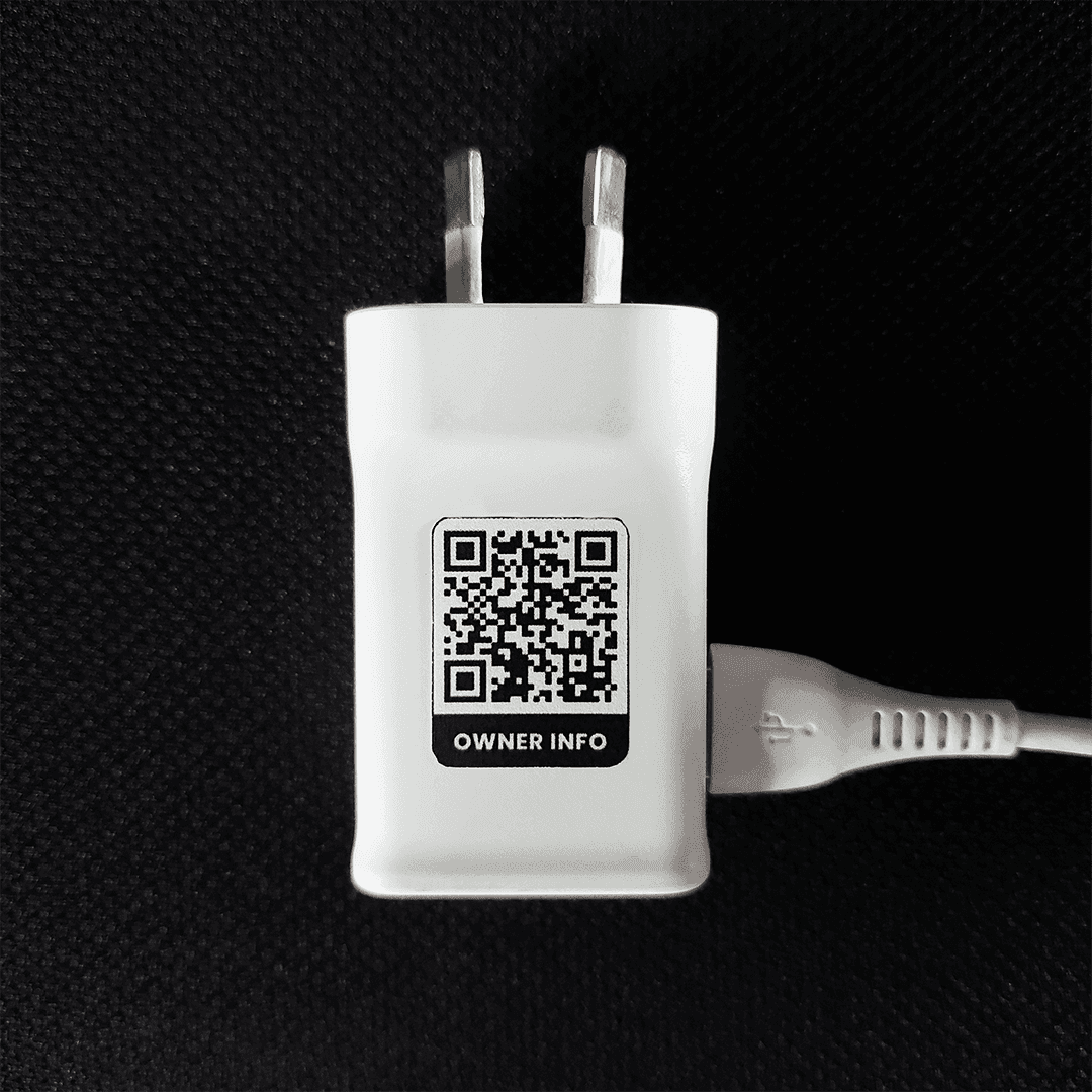 Phone charger tagged with a FindMe QR sticker